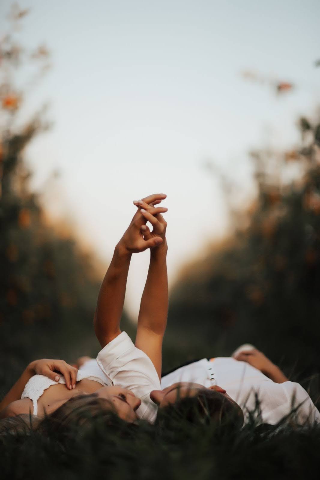 Couple holding hands in a park