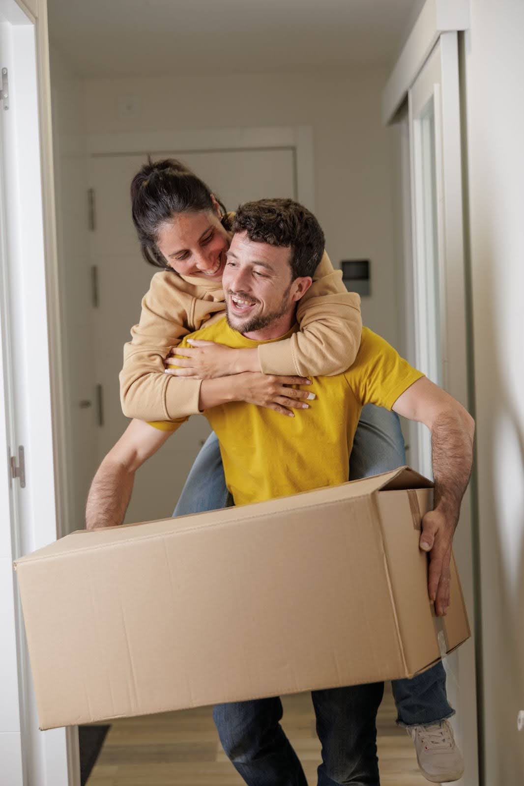 Young couple moving into their first home
